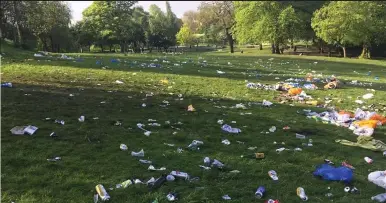  ??  ?? In a mess: Kelvingrov­e Park in Glasgow was strewn with rubbish after a party on Monday