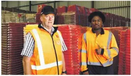  ?? MAIA HART ?? WM New Zealand Marlboroug­h branch manager Paul Withers, above left, with Nike Alvarez, who is helping with the wheelie bin roll-out in Marlboroug­h. Left: Wheelie bins stacked for delivery across Marlboroug­h in the coming weeks.