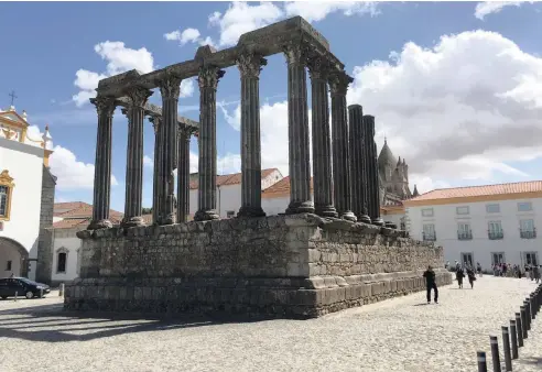  ??  ?? EVORA, which is called a “living museum,” offers layers of history, religious art and a foodie experience and receives about one-eighth the number of annual tourists that Sintra does