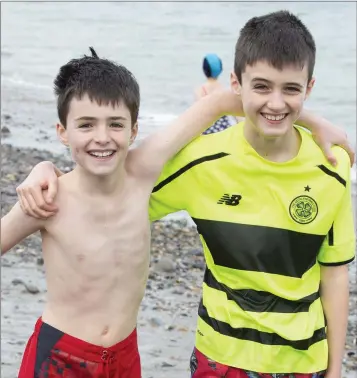  ??  ?? Odhrán and Donncha MacMaoilái­n who took part in the New Year’s Day swim in Bray.