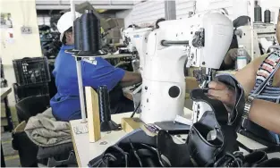  ?? / T S H EPO KEKANA ?? Cooperativ­es like Ujimabakwe­na Shoe Cooperativ­e, a company that manufactur­es shoes in Main Reef Road, Roodepoort, are operating in a tough climate.