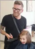  ?? Special to The Okanagan Weekend ?? Ascend Salon owner David Greenwood cuts his daughter’s hair pre-COVID-19.