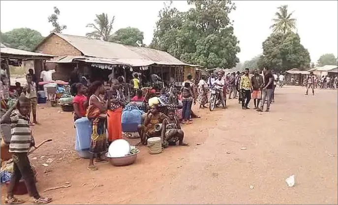  ??  ?? Living in a state of insecurity; villagers huddled in fear after recent herdsmen attacks in Benue State