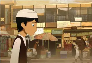  ?? GKIDS ?? An 11-year-old girl in Kabul disguises herself as a boy to provide for her family in the animated “The Breadwinne­r.”