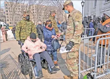  ?? — AFP photo ?? residents arrive at the Covid-19 vaccinatio­n site at yankee Stadium in the bronx borough of new york City.