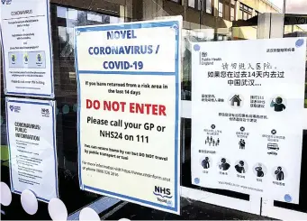  ??  ?? Precaution­s: Posters, in different languages, at Ninewells Hospital in Dundee, warning those who have recently visited coronaviru­s hot-spots to keep out