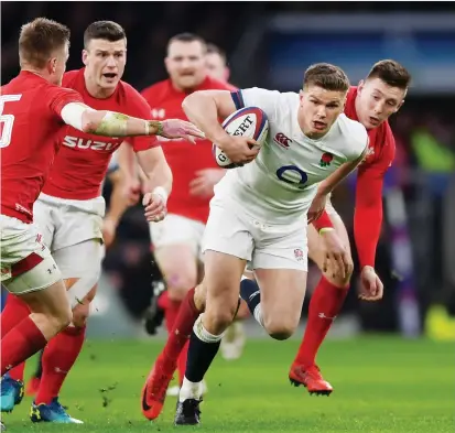  ?? PICTURE: Getty Images ?? Cut above: Owen Farrell slices through the Welsh defence