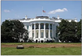  ?? (AP/Patrick Semansky) ?? A flag flies at half-staff Saturday over the White House in remembranc­e of U.S. Rep. John Lewis.