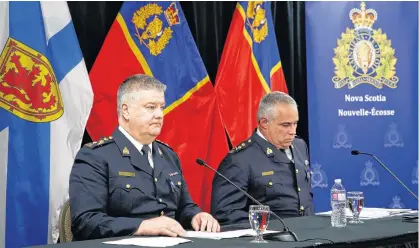  ?? NETWORK TIM KROCHAK • SALTWIRE ?? Dennis Daley, left, commanding officer of the Nova Scotia RCMP, and acting RCMP Commission­er Michael Duheme speak following the release of the final report of the Mass Casualty Commission March 30 in Truro.
