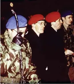  ??  ?? Above: former Northern Ireland First Minister Peter Robinson, second from left, at a UR rally. Right: Robinson with an AK47 in Israel. He denies any paramilita­ry involvemen­t. Below: a Glasgow Herald front page from the1980s