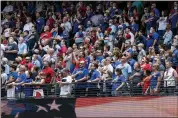  ?? JEFFREY MCWHORTER — THE ASSOCIATED PRESS ?? Fans stand for the national anthem before a baseball game between the Texas Rangers and the Toronto Blue Jays on Monday in Arlington, Texas.