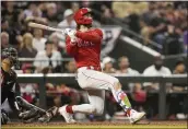  ?? BRYNN ANDERSON — THE ASSOCIATED PRESS ?? The Phillies' Bryce Harper watches his home run against the Arizona Diamondbac­ks during the sixth inning in Game 5of the NL Championsh­ip Series in Phoenix on Oct. 21.