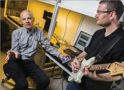  ?? JOHN ULAN, UNIVERSITY OF ALBERTA, THE CANADIAN PRESS ?? Rick McCreery, left, University of Alberta chemistry professor and Adam Bergen, a former post-doctoral fellow are among scientists who have used the latest in nanotechno­logy in a guitar pedal to duplicate a tube amplifier.