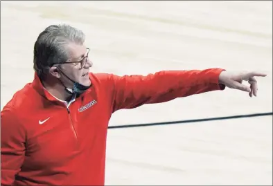  ?? Morry Gash / Associated Press ?? UConn head coach Geno Auriemma reacts during the second half of an NCAA college basketball game against Baylor in the Elite Eight round of the Women’s NCAA tournament on Monday at the Alamodome in San Antonio.