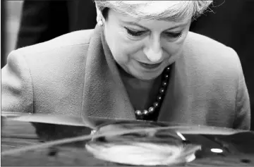  ??  ?? May leaves 10 Downing Street in central London, en route to Buckingham Palace to meet Queen Elizabeth II, the day after a general election in which the Conservati­ves lost their majority. — AFP photo