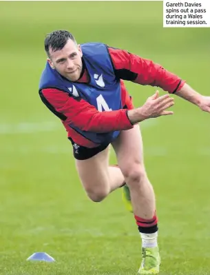  ??  ?? Gareth Davies spins out a pass during a Wales training session.