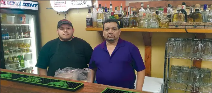  ?? SEAN LAUGHLIN/NWA MEDIA ?? BY SEAN LAUGHLIN/NWA MEDIA Taqueria Real Jacona of Rogers, is owned by Jesus Andrade (right), and head chef is his son Jose (left); it truly is a family affair on 8th St.