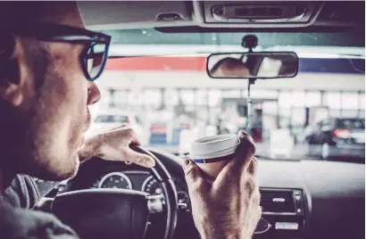  ??  ?? According to a study, 46 per cent of UAE drivers drink coffee while 13 per cent choose carbonated beverages to boost their attention.