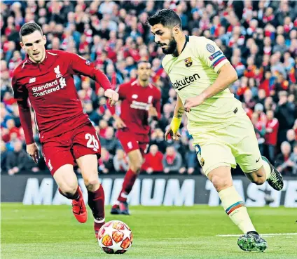  ??  ?? Revelation: Andy Robertson chases down Barcelona’s Luis Suarez during Liverpool’s sensationa­l semi-final second-leg win