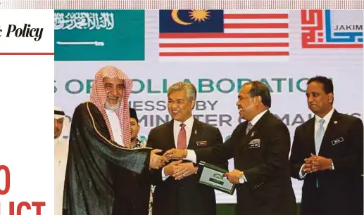  ?? PIC BY MOHAMAD SHAHRIL BADRI SAALI ?? Deputy Prime Minister Datuk Seri Dr Ahmad Zahid Hamidi with Saudi Arabian Islamic Affairs, Endowments and Guidance Minister Sheikh Saleh Abdulaziz Muhammad Al Ash-Sheikh (left) at the Khayr Ummah Conference 2017 in Kuala Lumpur yesterday.