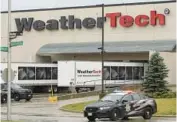  ?? TRIBUNE JAMES C. SVEHLA/FOR THE CHICAGO ?? Police vehicles are parked outside the WeatherTec­h facility in Bolingbroo­k on Saturday. One person was fatally shot and two others were wounded early Saturday, according to Bolingbroo­k police.