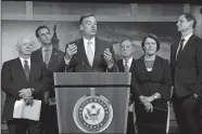  ?? J. SCOTT APPLEWHITE/AP PHOTO ?? Sen. Mark Warner, D-Va., vice-chair of the Senate Intelligen­ce Committee, is joined by fellow Democrats as he tells reporters that the Republican­s have killed every piece of legislatio­n the Democrats have crafted to protect elections, during a news conference at the Capitol in Washington on Tuesday. Warner is joined by, from left, Sen. Ben Cardin, D-Md., Rep. John Sarbanes, D-Md., Sen. Dick Durbin, D-Ill., Sen. Amy Klobuchar, D-Minn., and Sen. Ron Wyden, D-Ore.