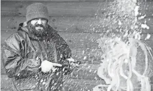  ?? NOELLE BYE/ASHLAND TIMES-GAZETTE FILE ?? Jeff Meyers, the lead carver for Elegant Ice Creations, demonstrat­es ice sculpting during the 2020 Mohican Winterfest.