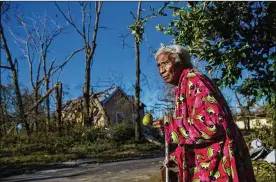  ?? SCOTT MCINTYRE/THE NEW YORK TIMES ?? Panama City, Fla., resident Sallie Benton, 92, surveys the damage in her neighborho­od from Hurricane Michael.