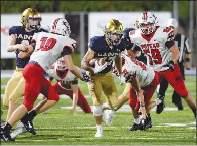  ?? (NWA Democrat-Gazette/Andy Shupe) ?? Shiloh Christian running back Cam Wiedemann carries the ball Friday past Poteau (Okla.) safety Ben Brooks (25) during the second half at Champions Stadium in Springdale. Visit nwaonline.com/200905Dail­y/ for today’s photo gallery.