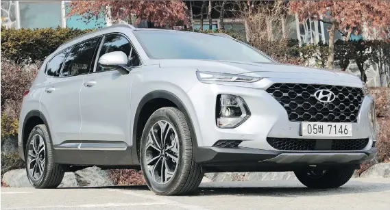  ?? PHOTOS: GRAEME FLETCHER/DRIVING ?? The 2019 Hyundai Santa Fe offers more cargo space than the Ford Edge. It also boasts good power and fuel economy and handles well.