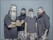  ?? ZACH DILGARD/A&E ?? This “Duck Dynasty” family — Phil Robertson (from left), his son Jase Robertson, his brother Si Robertson and his son Willie Robertson — parlayed their duck-hunting ways into a growing duck- call business and a hit A&E reality show.