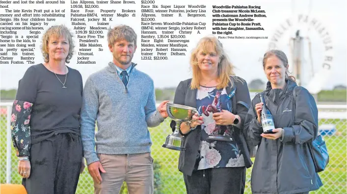  ?? Photo / Peter Rubery, raceimages.co.nz ?? Woodville-Pahiatua Racing Club treasurer Nicola McLean, with chairman Andrew Bolton, presents the WoodvilleP­ahiatua Cup to Rosie Pratt, with her daughter, Samantha, to the right.