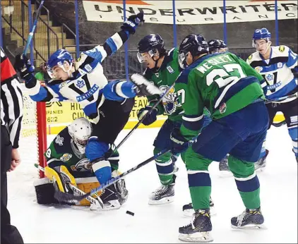  ?? DAVE CROMPTON/Penticton Herald ?? An off-balance Penticton Vees forward Grant Cruikshank tries to avoid colliding with Surrey Eagles goalie Nic Tallarico Wednesday at the SOEC. Cruikshank received a minor and game misconduct on the play. The Vees won 7-1.