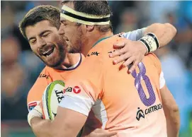  ?? Picture: GALLO ?? WELL DONE: Willie le Roux congratula­tes try scorer Niell Jordaan during yesterday’s win over the Bulls. It was Le Roux’s last match for the Cheetahs — he is moving to the Sharks