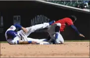  ?? MATT MARTON — THE ASSOCIATED PRESS ?? Chicago Cubs second baseman David Bote, left, is tagged out by Atlanta Braves second baseman Ozzie Albiies during the sixth inning of Friday’s game at Chicago.