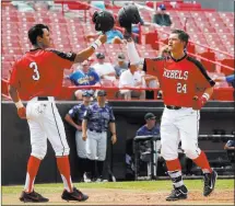  ?? Andrea Cornejo ?? UNLV second baseman Nick Rodriguez
(3) and first baseman Nick Ames knock helmets to celebrate a run against Air Force on Sunday at
Earl Wilson Stadium. The Rebels won 10-7.
Las Vegas Review-journal @dreacornej­o