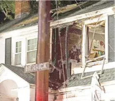  ??  ?? A home partly damaged after a gas explosion in North Andover, Massachuse­tts.