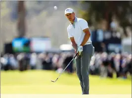  ?? ASSOCIATED PRESS PHOTOS ?? JORDAN SPIETH CHIPS ONTO the eighth green during the first round of the Genesis Open golf tournament at Riviera Country Club Feb. 15 in the Pacific Palisades area of Los Angeles.