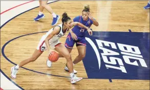  ?? David Butler II / Associated Press ?? UConn forward Olivia Nelson-Ododa drives the lane against UMass Lowell forward Denise Solis during the first half on Saturday in Storrs.