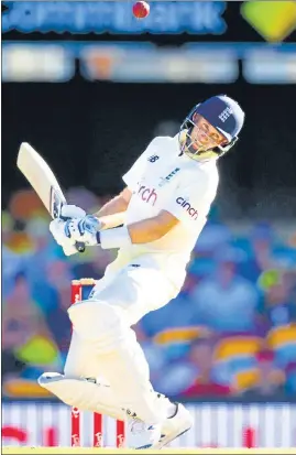  ?? ?? England's Joe Root avoids a delivery during day three of the first Ashes Test at the Gabba in Brisbane on Friday.