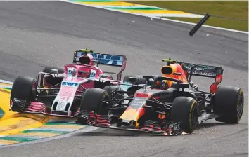  ?? Rex Features ?? Force India’s Esteban Ocon collides with race leader Max Verstappen of Red Bull during the Brazilian GP at Autodromo Jose Carlos Pace in Brazil earlier this month.