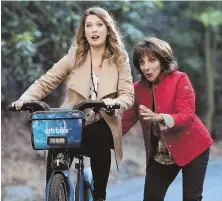  ??  ?? LETTING GO: Briga Heelan, left, stars as a TV producer who can’t escape her mom (Andrea Martin, right). She works on a news program with battling anchors John Michael Higgins and Nicole Richie, top.