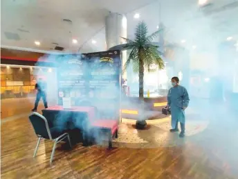  ?? — Photo from Plaza Merdeka’s Facebook page ?? A worker conducts fogging over the foyer of Plaza Merdeka.