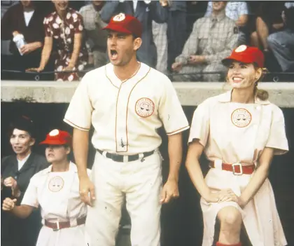  ?? COLUMBIA PICTURES ?? Tom Hanks and Geena Davis star in A League of Their Own, the true story of an all-female baseball team set during the Second World War. The 1992 movie still proves entertaini­ng for contempora­ry audiences, who may grow nostalgic for its summertime sounds and sentiments.
