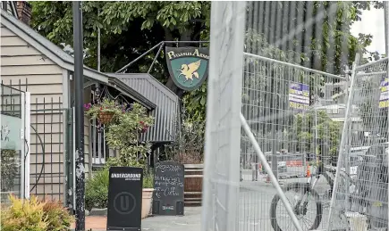  ?? PHOTO: DAVID WALKER/STUFF ?? Roadworks fences on Oxford Tce affected access to buildings, including the DHB headquarte­rs and Pegasus Arms bar.