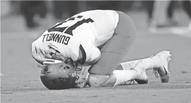  ?? JAYNE KAMIN-ONCEA/GETTY IMAGES ?? Arizona quarterbac­k Grant Gunnell was injured on the first play of the game against UCLA at the Rose Bowl on Saturday in Pasadena, Calif. Gunnell left the game.