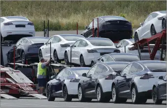  ?? BEN MARGOT — THE ASSOCIATED PRESS ?? After two more cuts to Model 3prices, Tesla's cheapest vehicle starts at $42,990. That doesn't include a $7,500 U.S. tax credit for electric vehicles that went into effect in January, which can bring the price to $35,500.