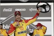  ?? JOHN RAOUX — THE ASSOCIATED PRESS ?? Joey Logano celebrates in Victory Lane after winning the first of the two Daytona 500qualify­ing races at Daytona Internatio­nal Speedway on Thursday in Daytona Beach, Fla.