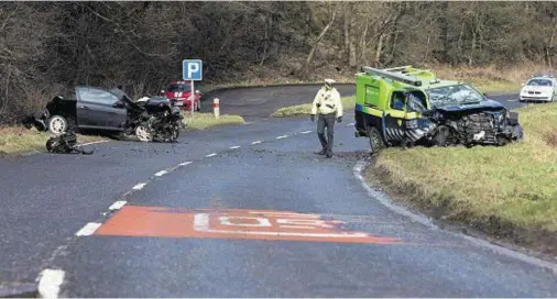  ??  ?? AFTERMATH: Police at the scene after a car and van collide on the A947 Turriff to Aberdeen road, near Fyvie, earlier this month