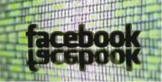  ?? — Reuters File Photo ?? A 3D printed Facebook logo is seen in front of displayed cyber code in this illustrati­on.